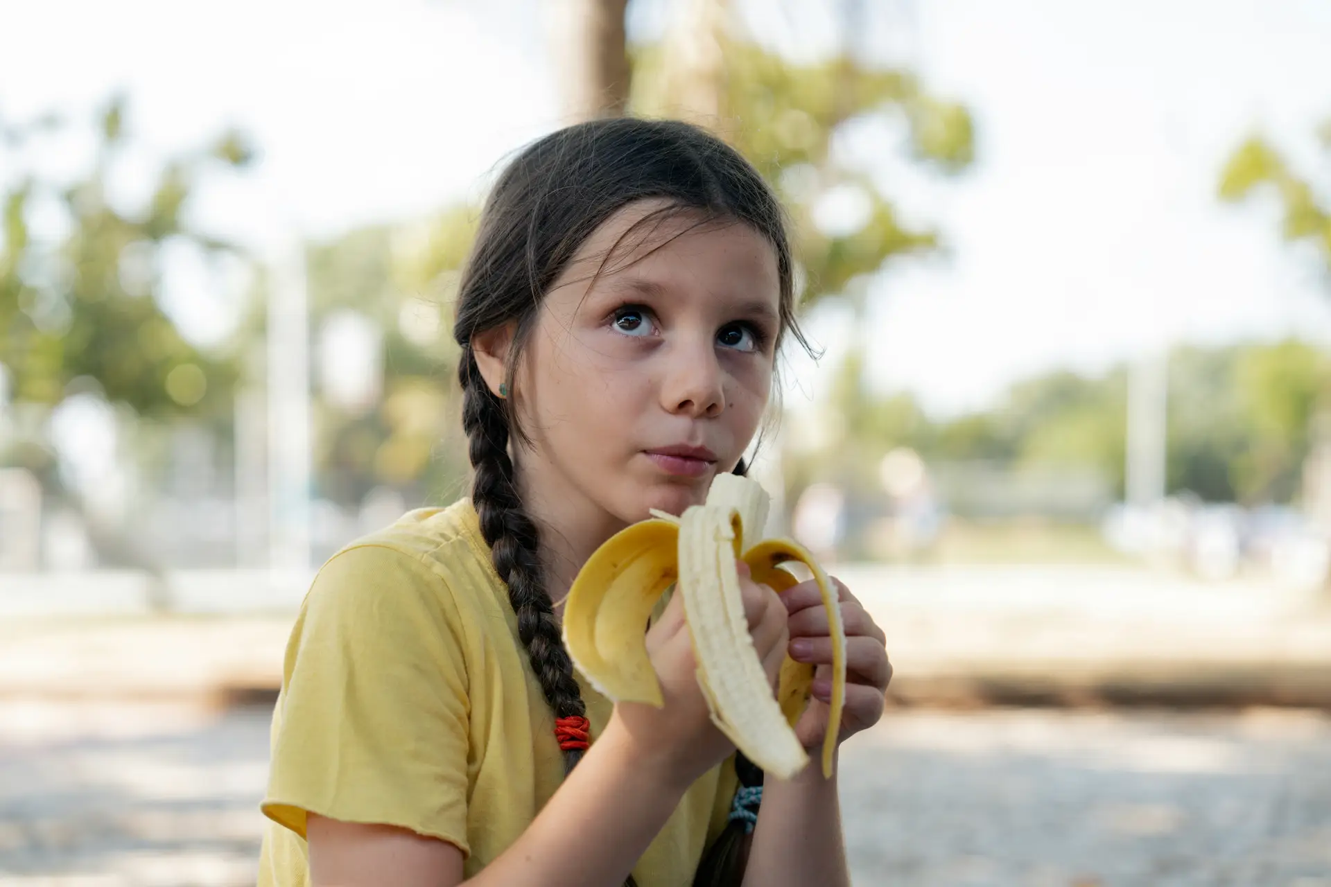 ASD child in feeding therapy tentitivly trying a banana