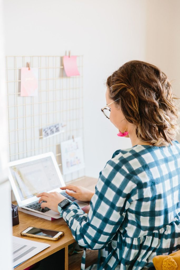 Paediatric clinical nutritionist, feeding therapist and clinical director at Juni Paediatrics, Court Garfoot writing notes on her laptop